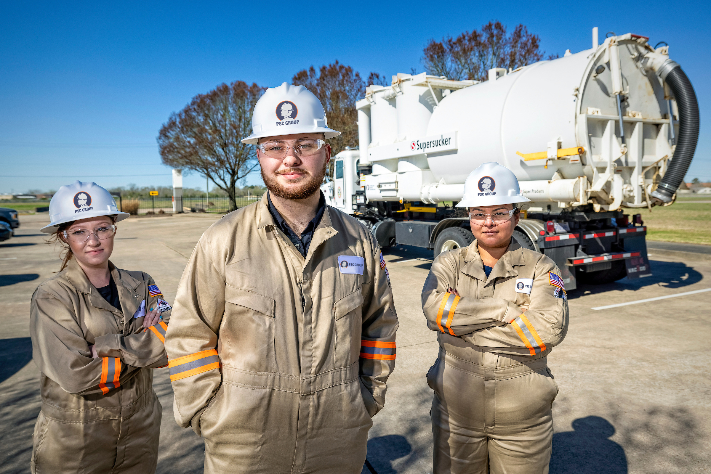 Industrial cleaning technicians with vacuum truck